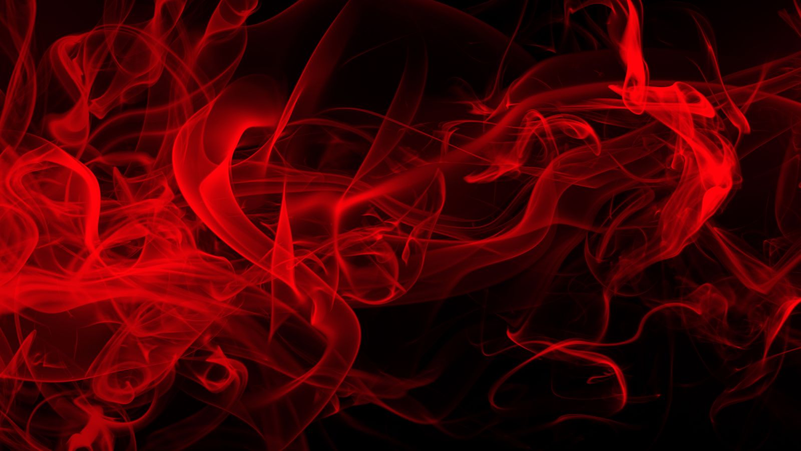 Das Bild zeigt roten Rauch vor schwarzem Hintergrund.