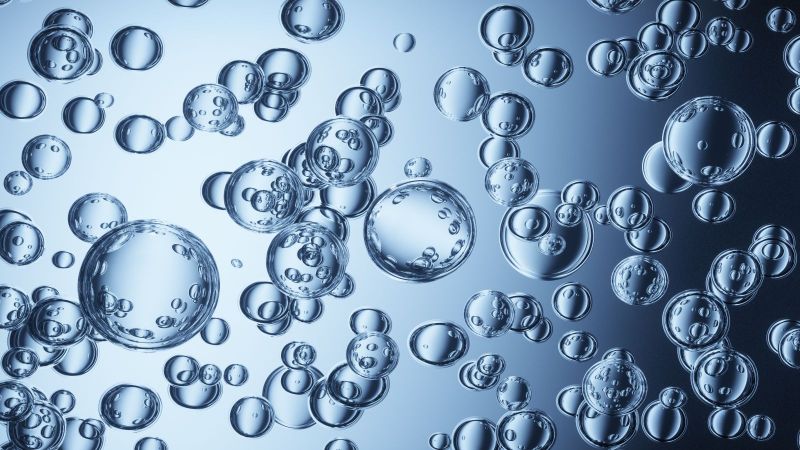Das Bild zeigt Luftblasen in Wasser.